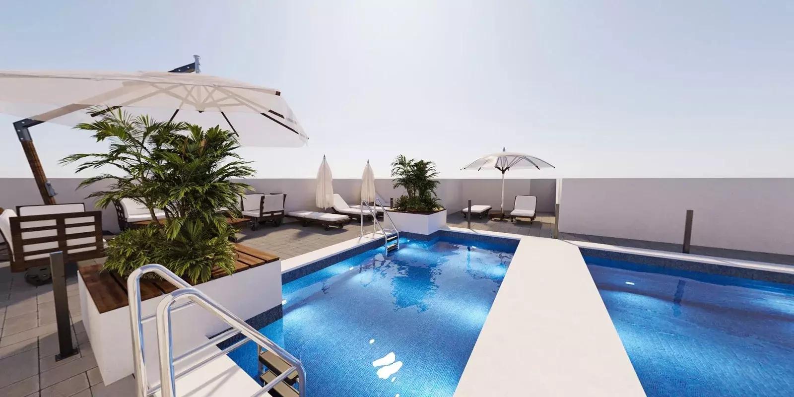 Shared pool deck at AG Square, Dubai Land Residence Complex