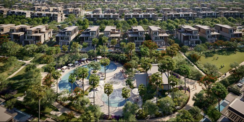 Nad Al Sheba Gardens Phase 7 exterior view of townhouse cluster with landscaped street, Nad Al Sheba, Dubai