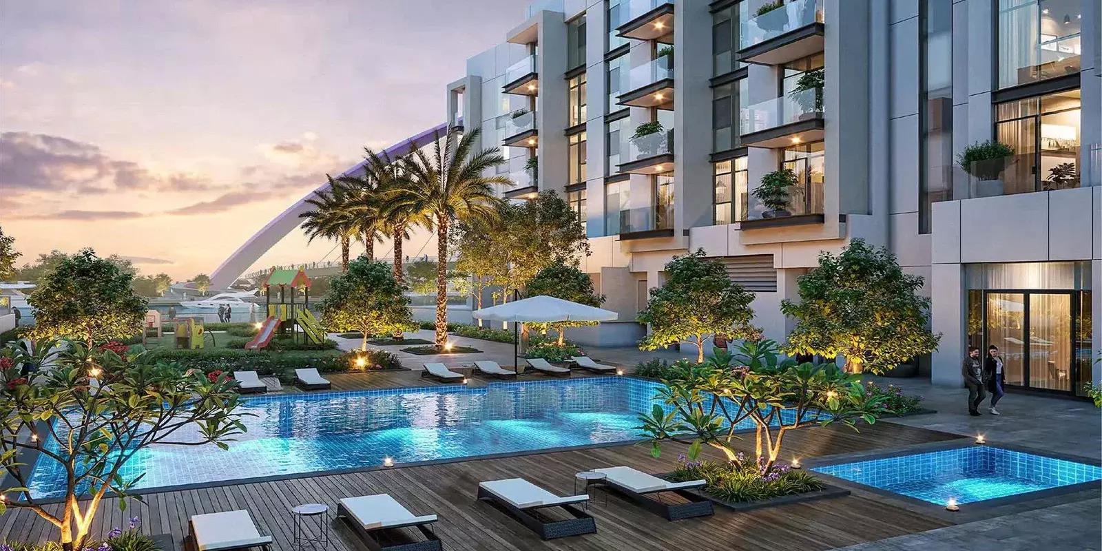 Living room interior with canal-facing balcony at Canal Front Residences, Al Wasl