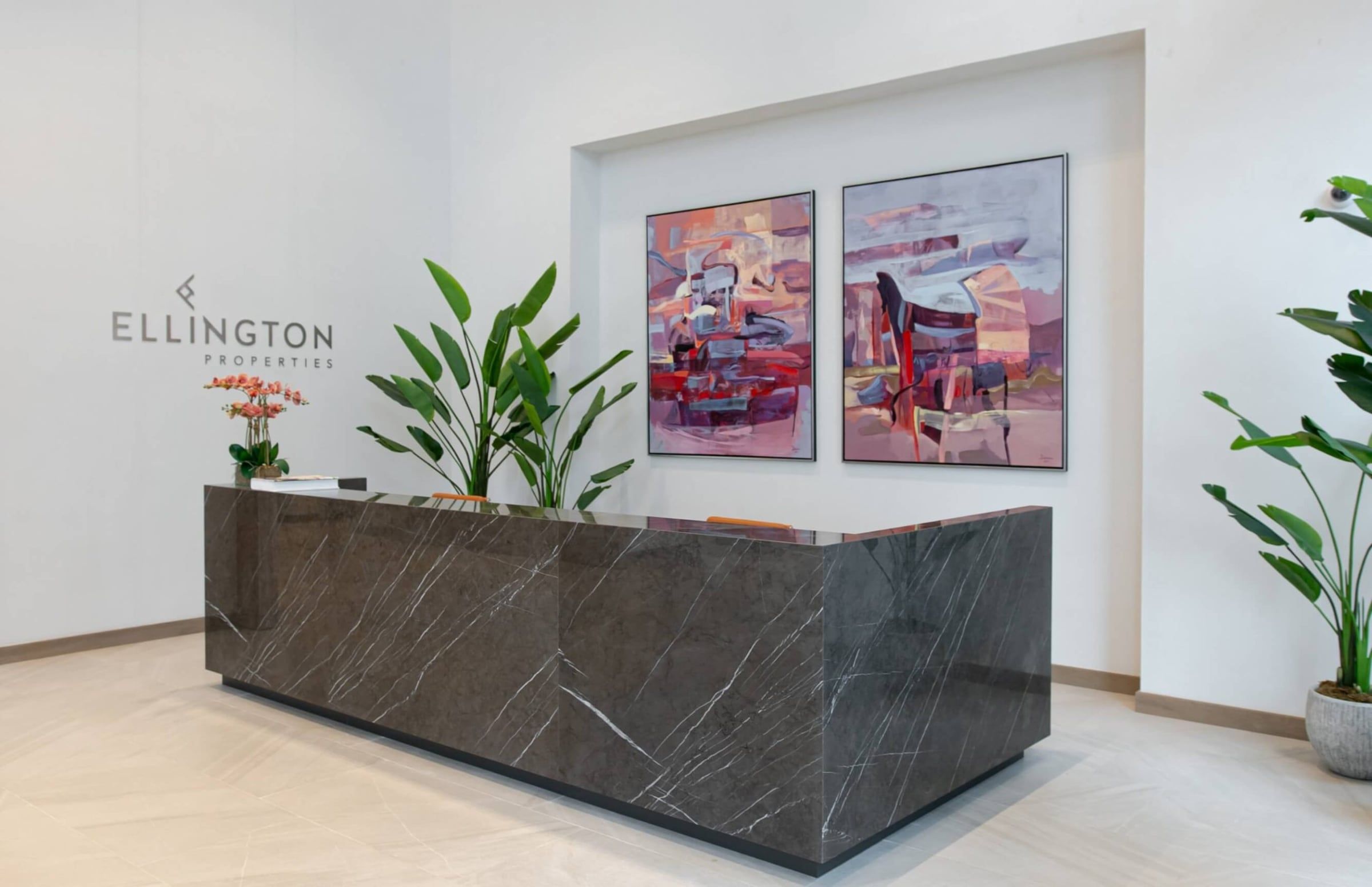 Wilton Terraces lobby reception desk with Ellington Properties branding