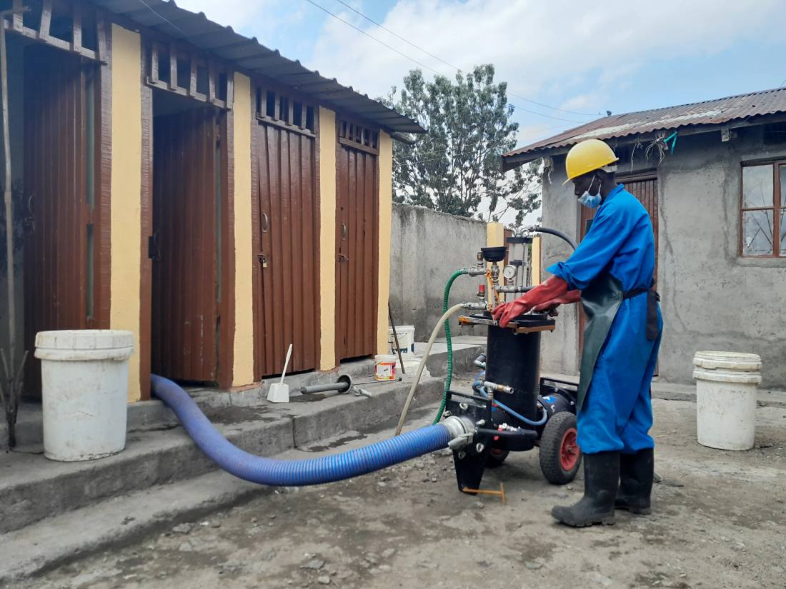 A man works at a sanitation facility.