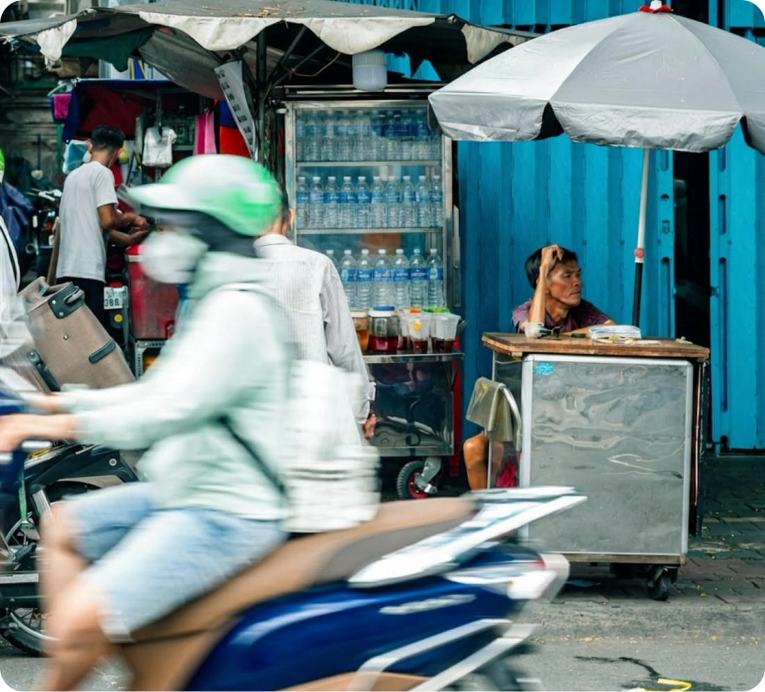 A street vendor selling bottled drinking water from a stall