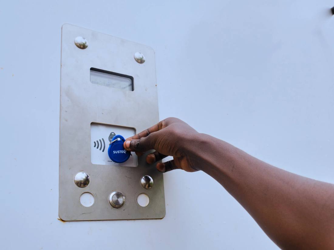 A hand using a keytag.