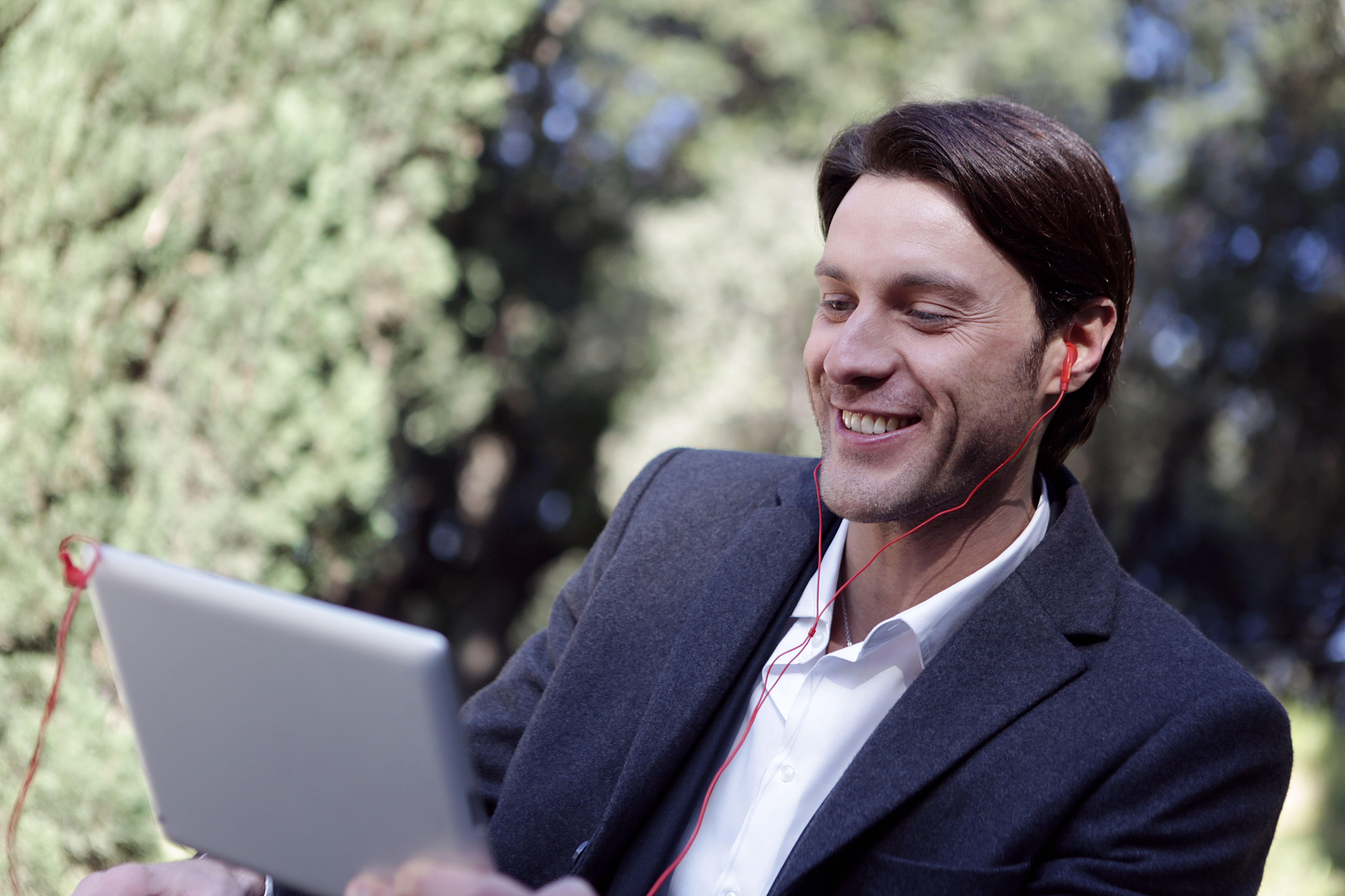 Happy man on tablet