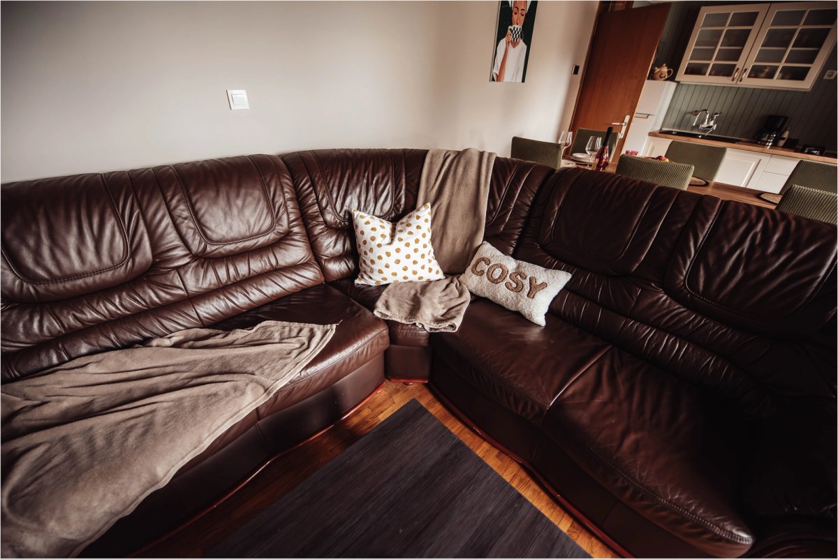 Open-plan space connecting the living room, dining area and kitchen
