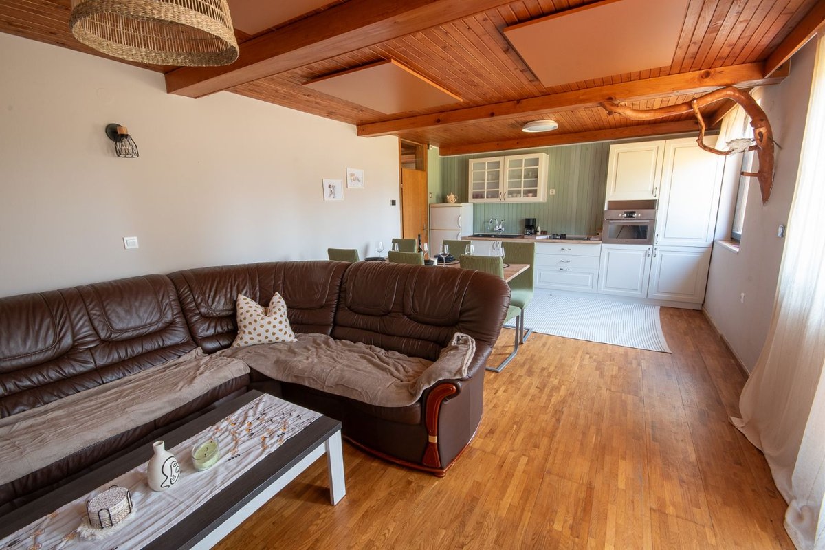 Open-plan space connecting the living room, dining area and kitchen