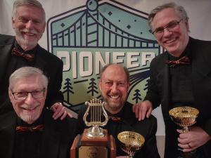 Senior quartet champions Fireball with trophies and Pioneer logo