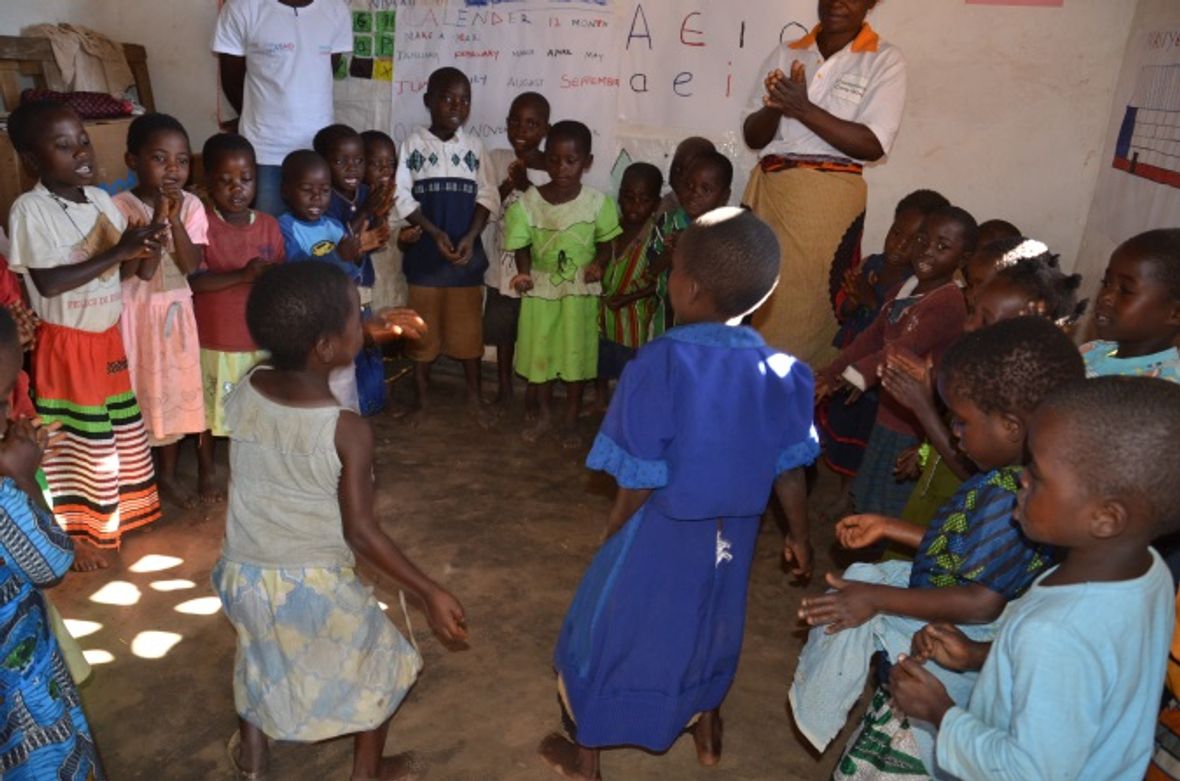 Children learning an action game at Masiye CBCC