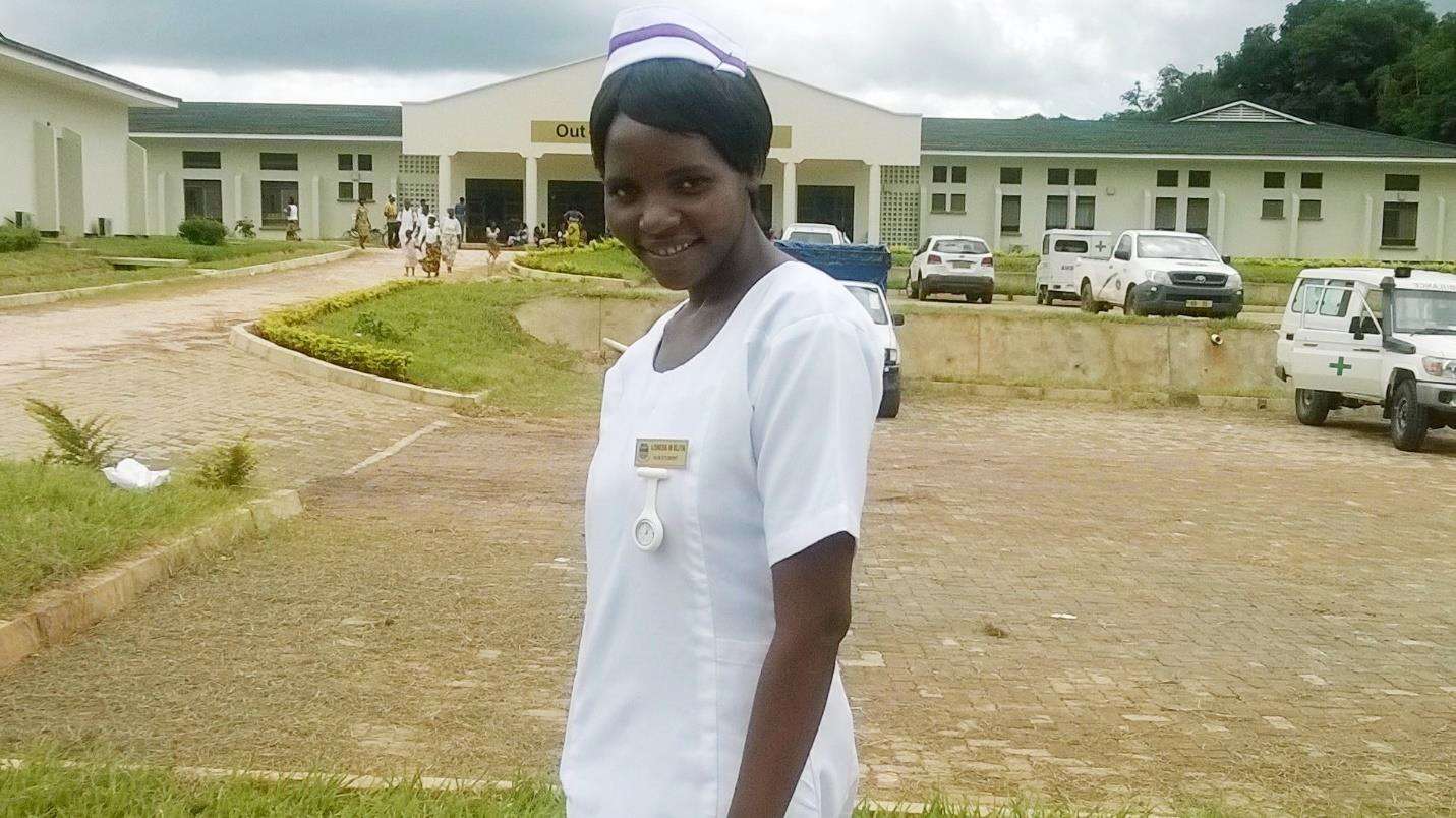 Loness Eliya outside Nkhata-Bay district hospital in the Northern region of Malawi during practical work-second year at Kamuzu College of Nursing (KCN)