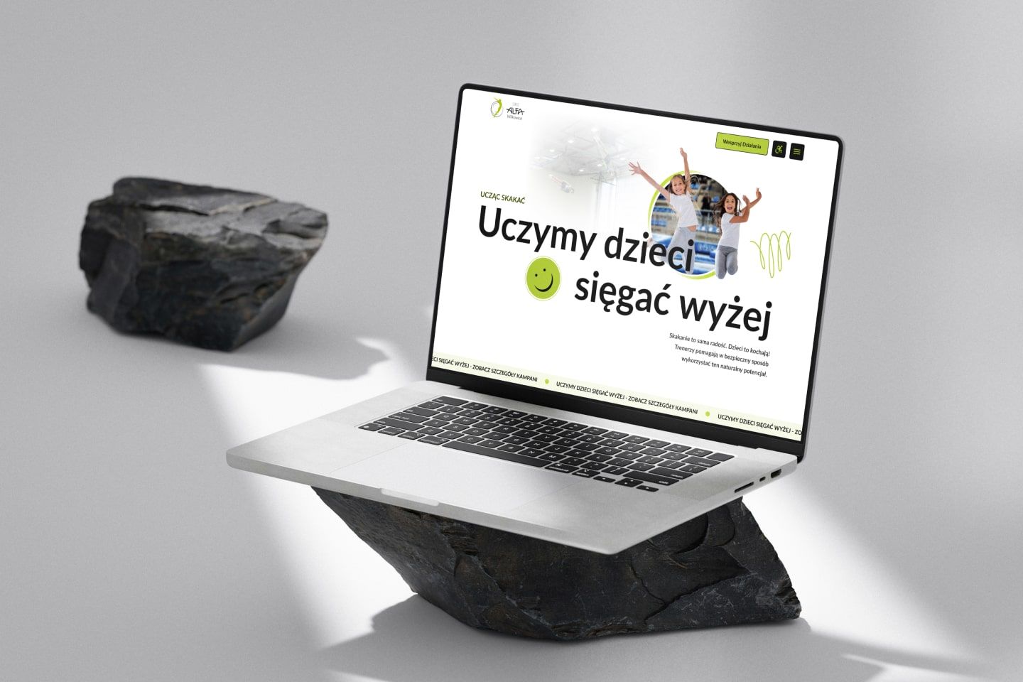 Home Page Banner Mockup on laptop view: By teaching trampoline jumping - we teach children to achieve more