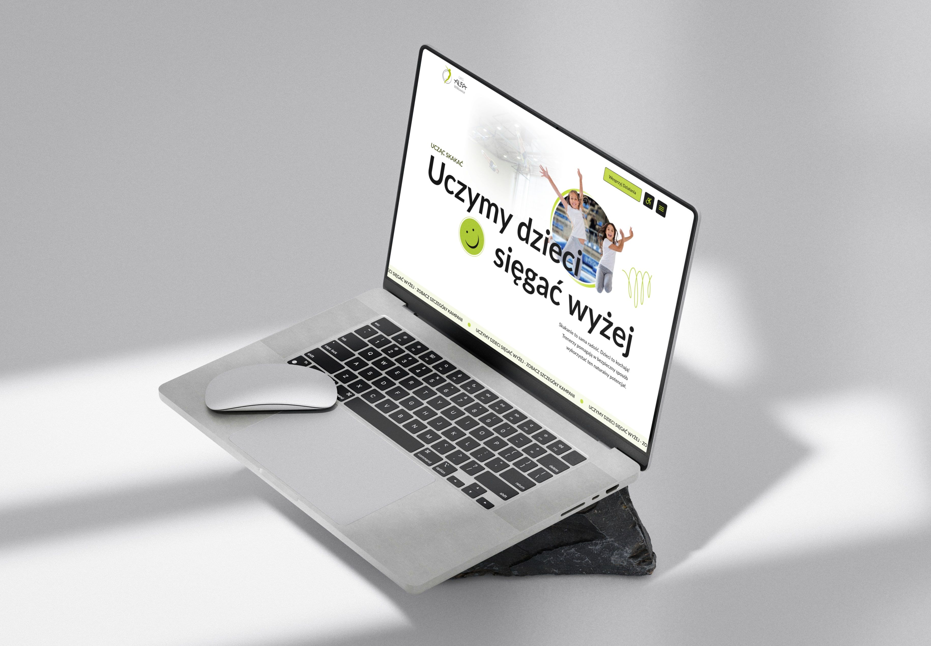 Home Page Banner Mockup on laptop view:  By teaching trampoline jumping - we teach children to achieve more