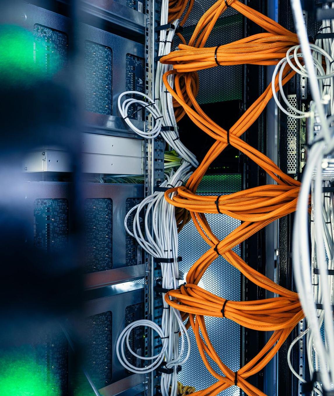 Inside a Sparxity system: boards and bundled orange and white cabling