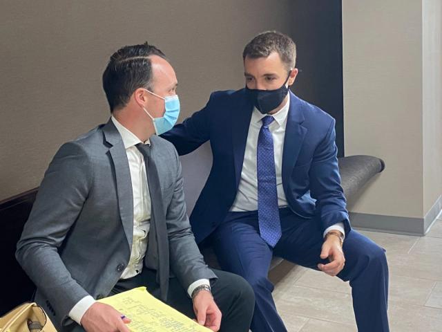 John Michael Pipes and John Bonacorsi conferring in court in 2021