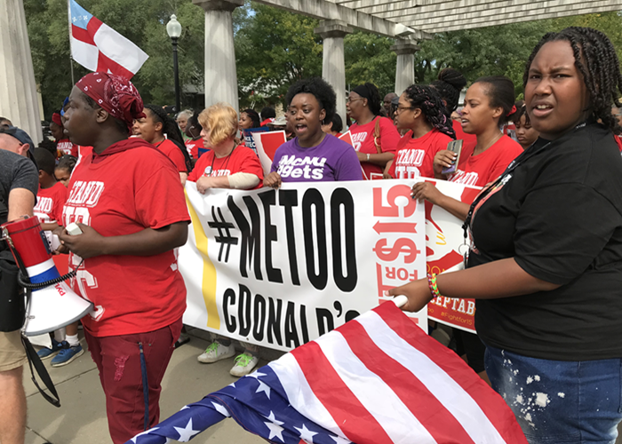 Stand Up KC workers march with a #MeToo McDonald's banner