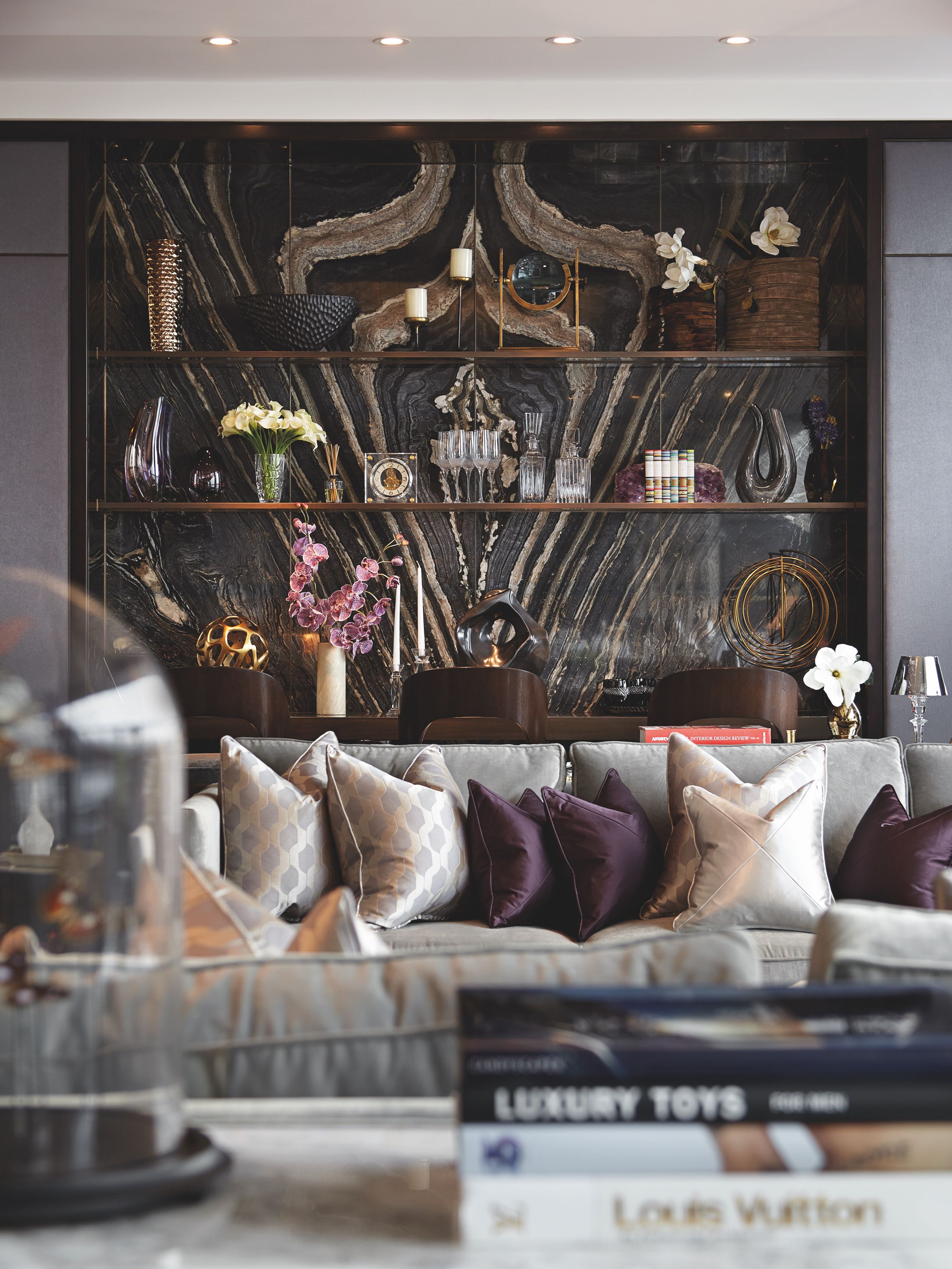 Client portfolio photograph: Plaza interior with a veined stone wall