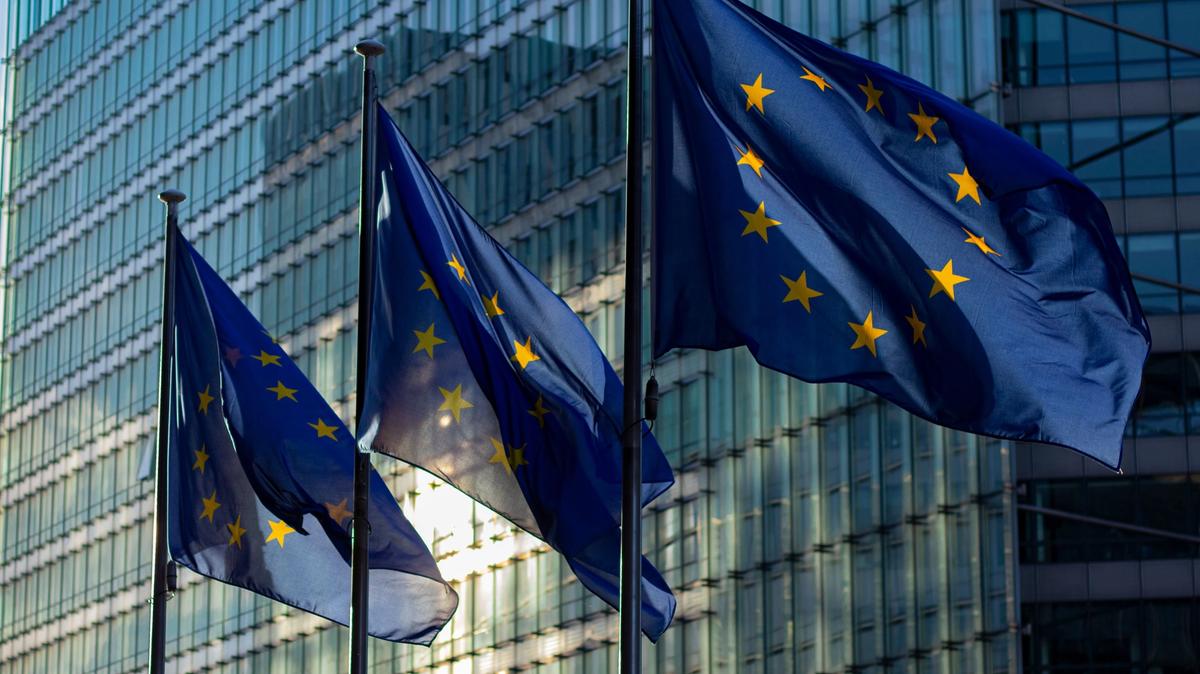 European Union flags outside an institutional building in Brussels
