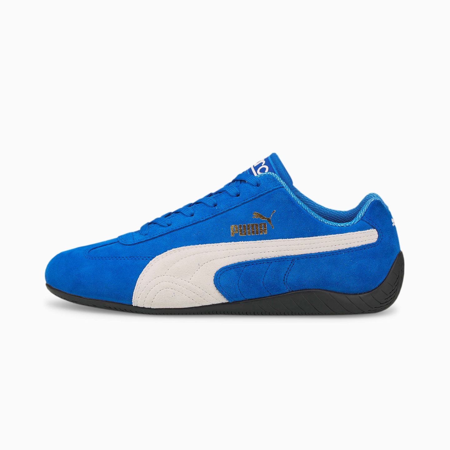 a pair of blue and white puma shoes on a white background