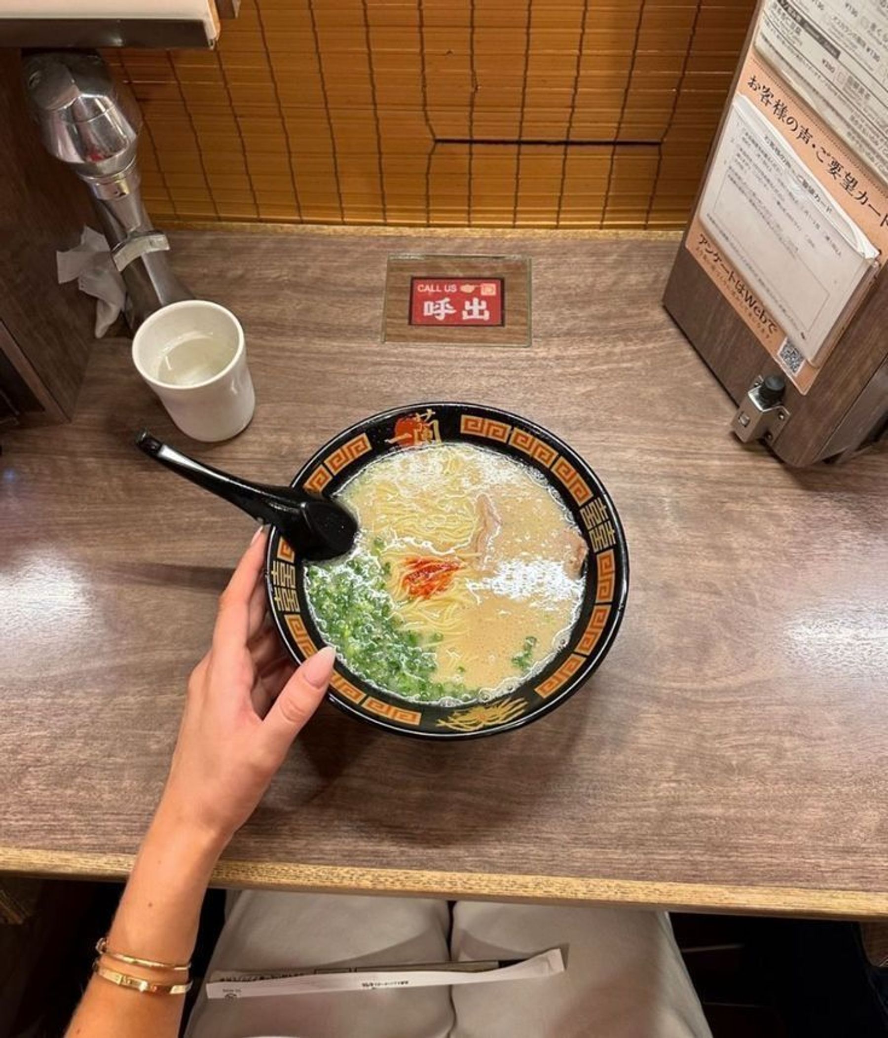 A bowl of ramen served at a counter in Japan.