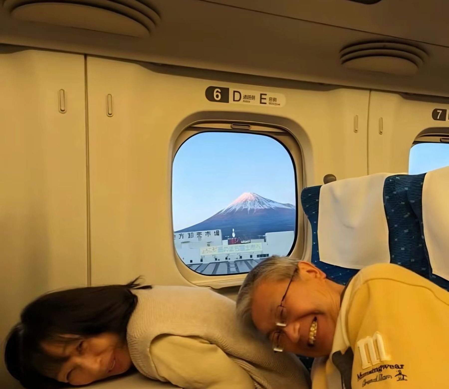 Mount Fuji seen through the window of a Japanese bullet train.