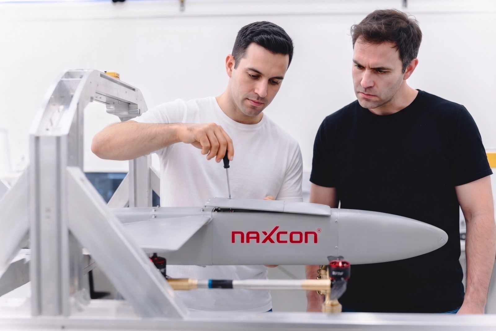 Two NAXCON engineers assembling an unmanned aircraft