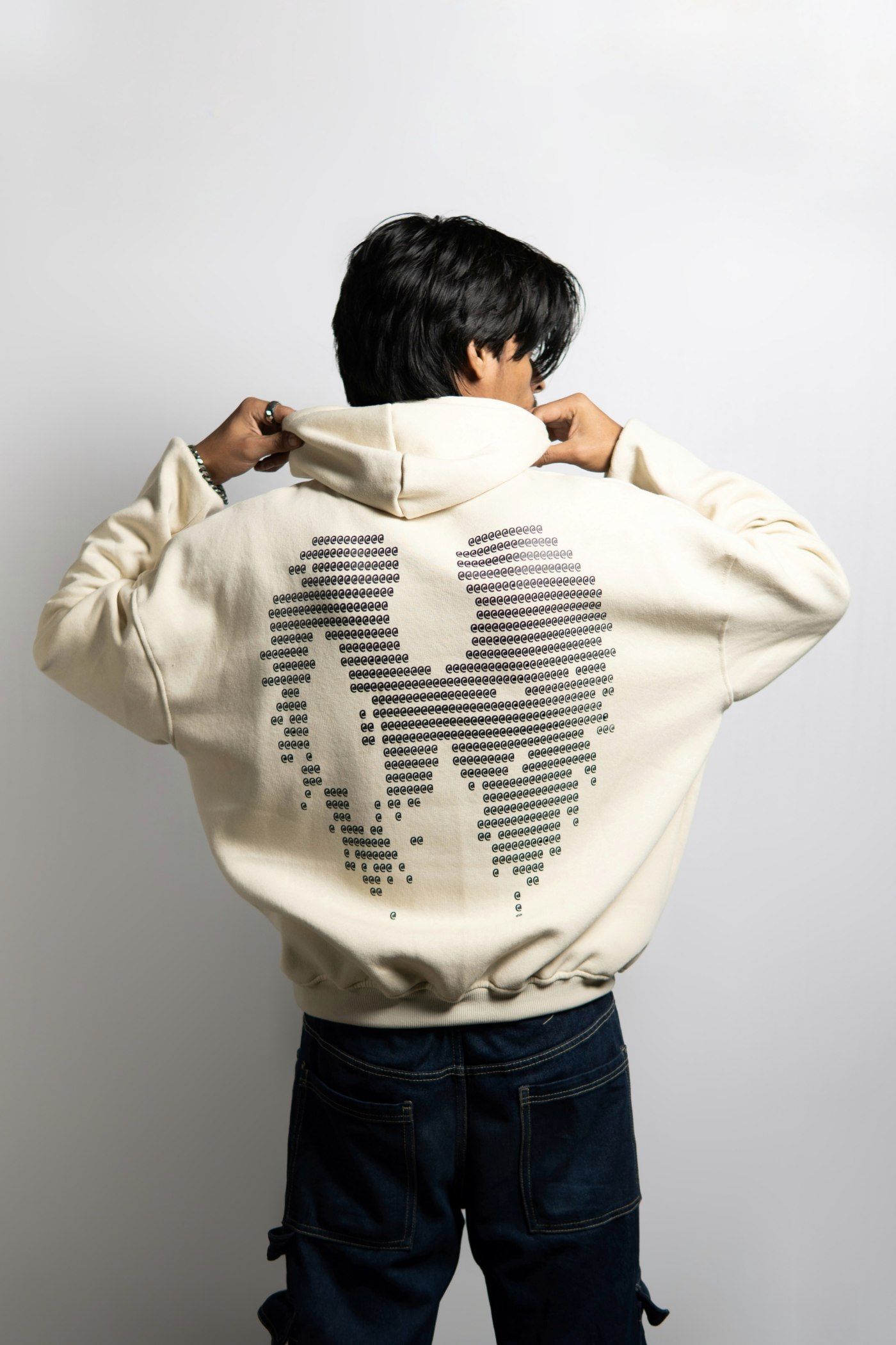 Tamzid Toufik modeling the Unsincity Off-White Boxy Cropped Hoodie