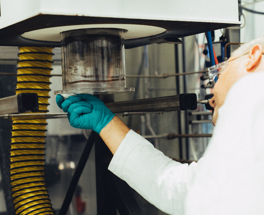 scientist looking at lab equipment