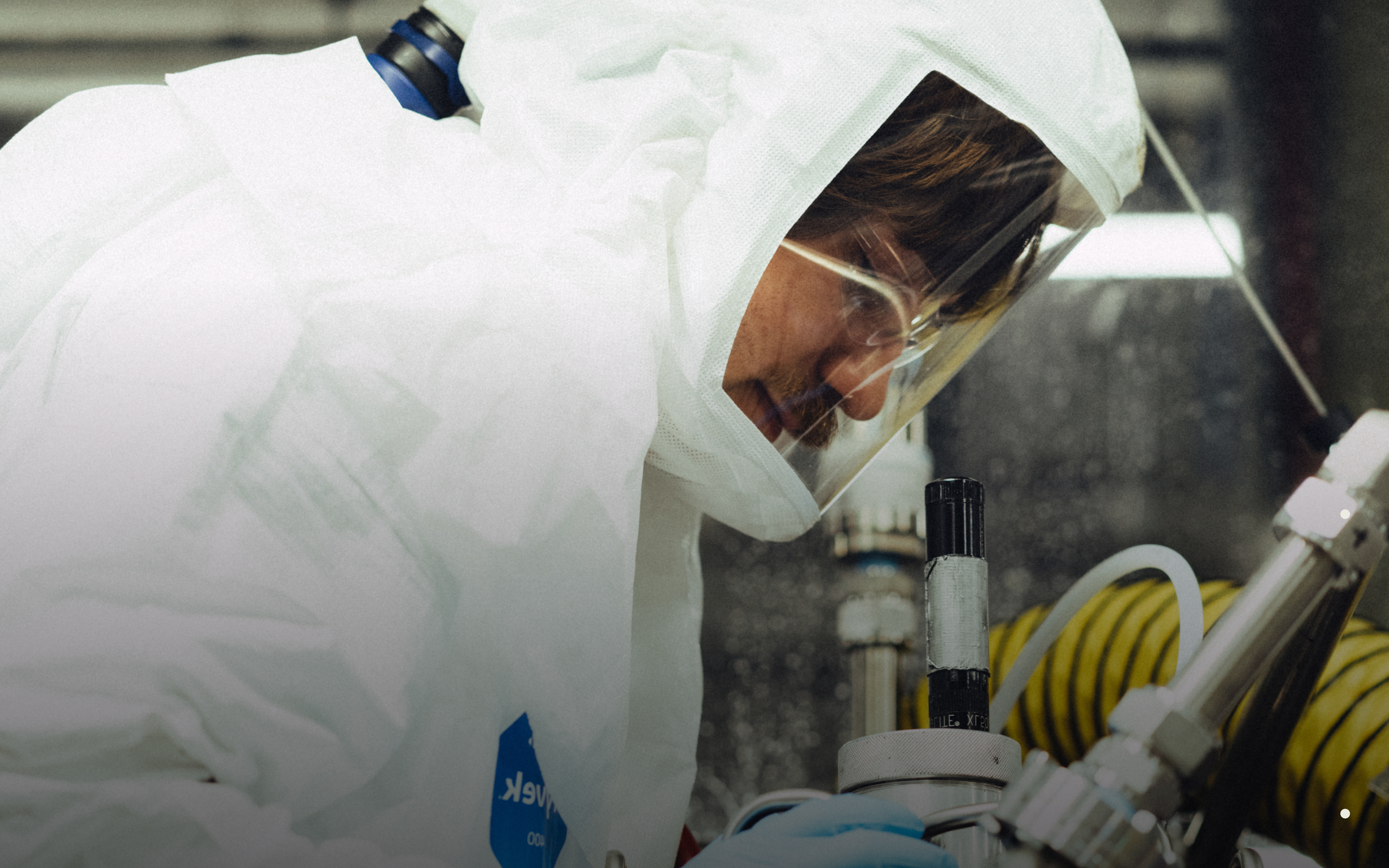 A scientist in a lab suit