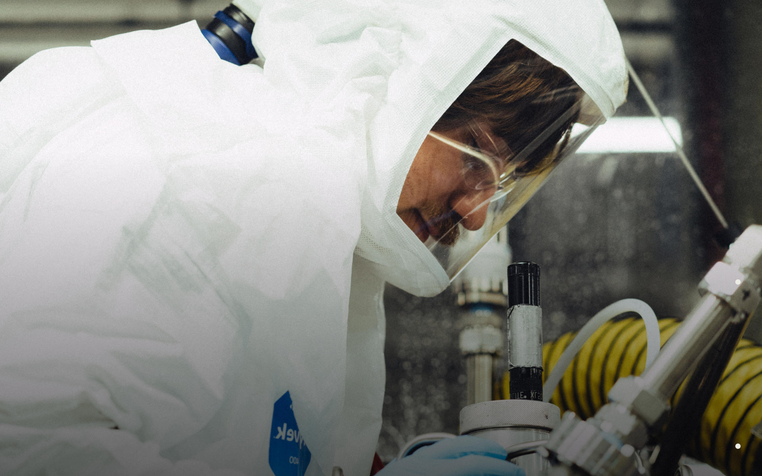 A scientist in a lab suit