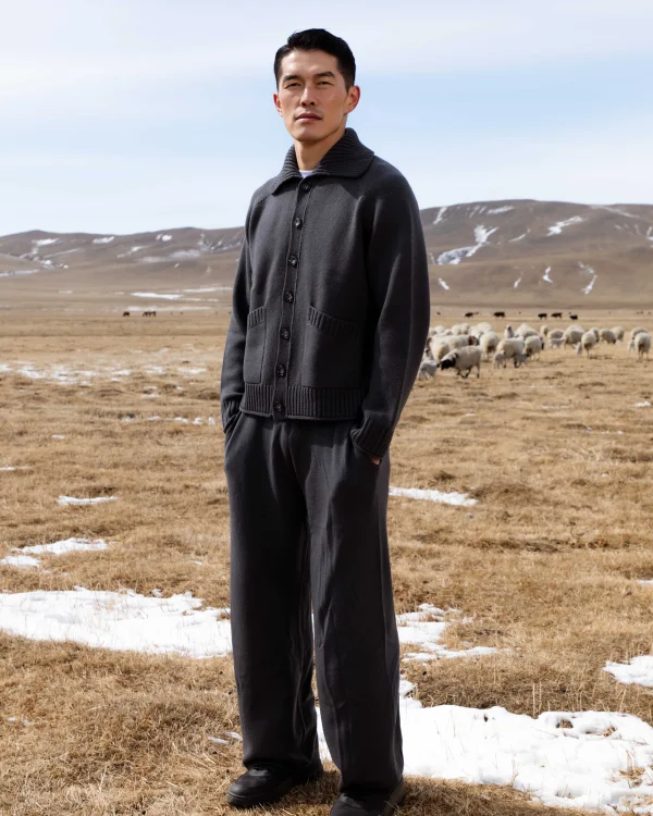man in a Mongolian field in a cashmere jumpsuit