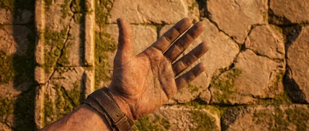 Eine geöffnete Hand mit abgespreiztem Daumen bildet die V-Form der Zahl fünf vor einem antiken Steinhintergrund Eine geöffnete Hand mit abgespreiztem Daumen bildet die V-Form der Zahl fünf vor einem antiken Steinhintergrund