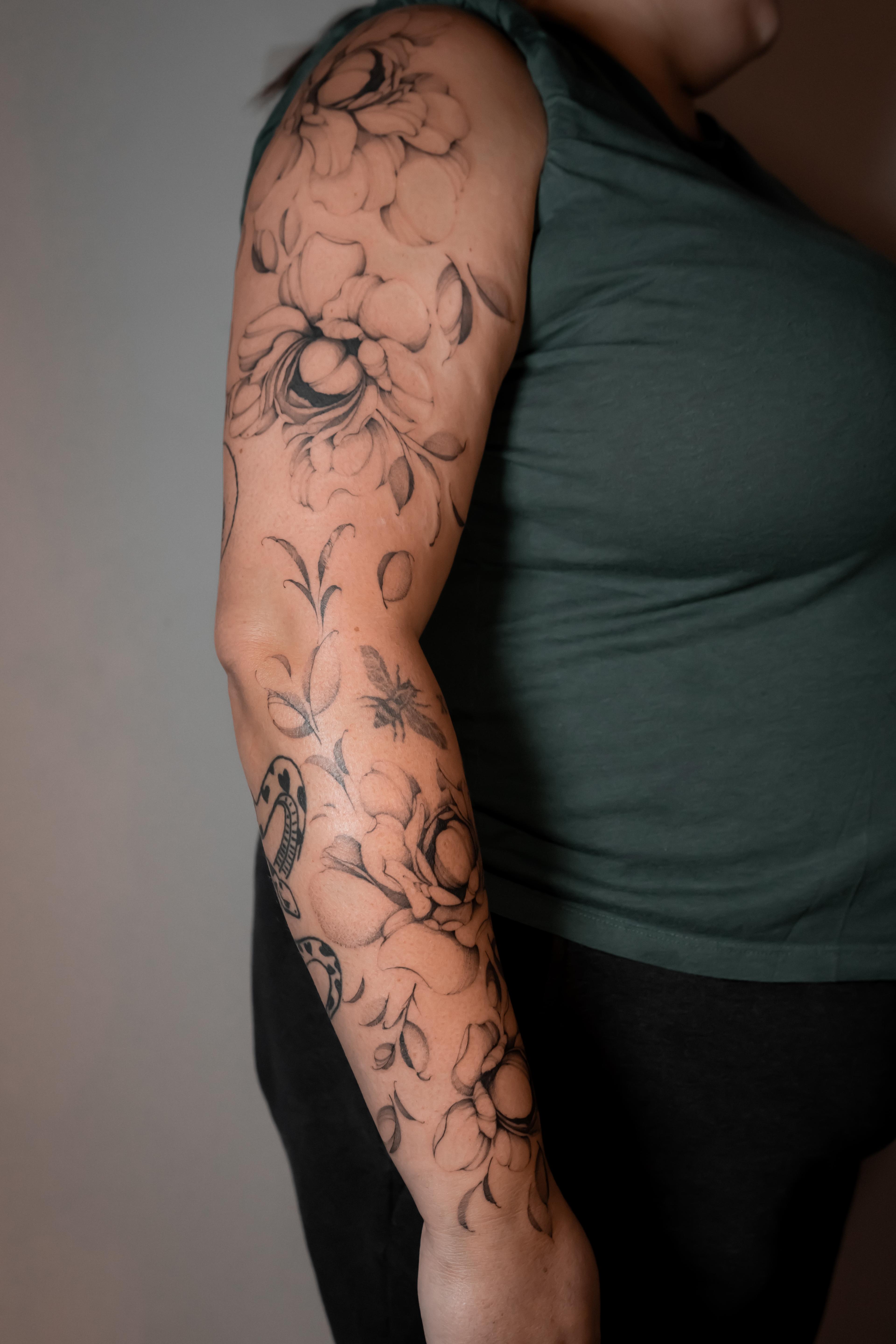 Fine-line peony sleeve with shaded leaves.