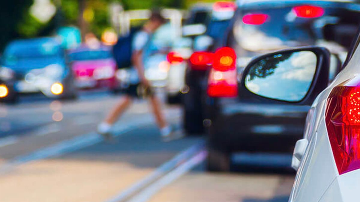 Traffic Waiting For Person To Cross Street