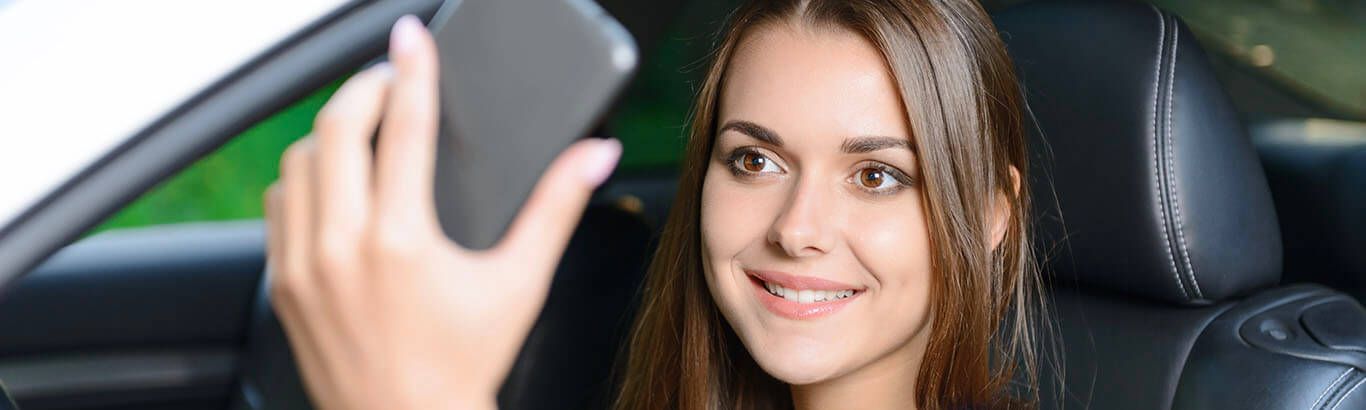 NY Lady In Car Taking Selfie