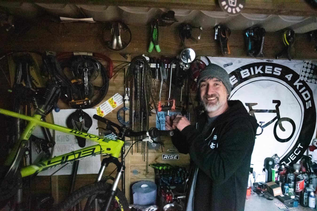 Mike Jones in his shed, in which it's so dark that the camera struggles to expose the shot