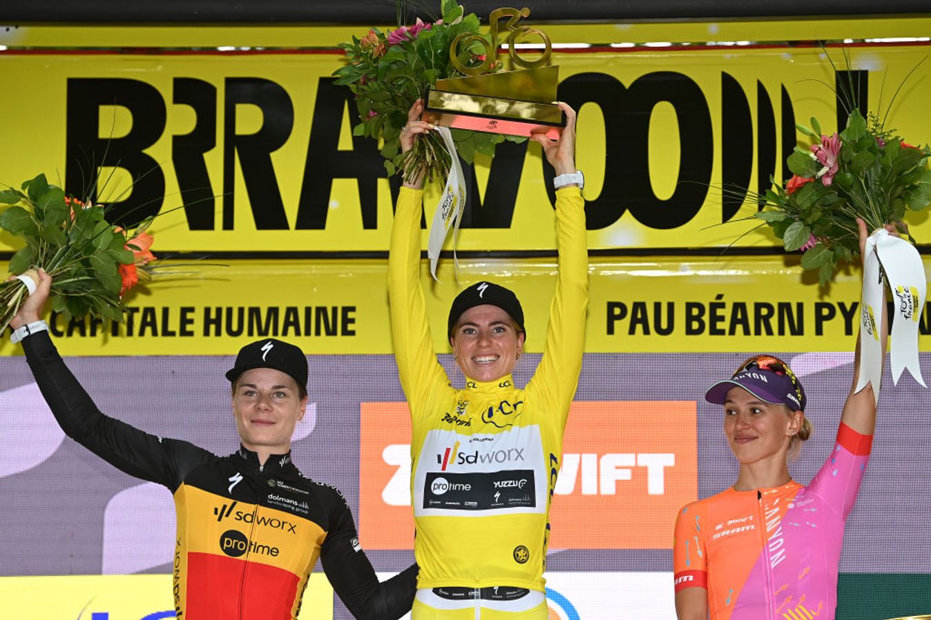 Lotte Kopecky (left) on the podium of the Tour de France Femmes