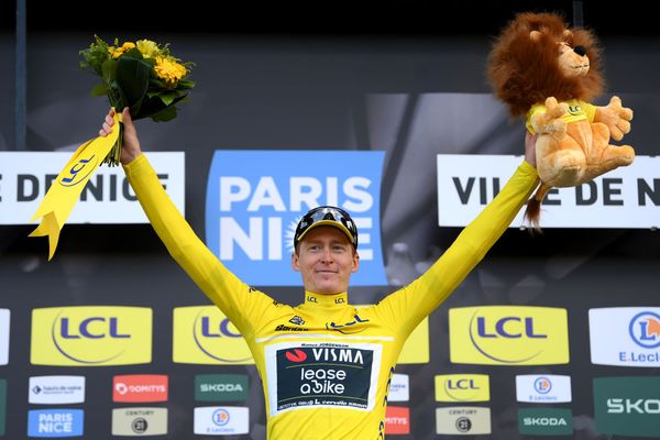 Matteo Jorgenson celebrates on the podium of Paris-Nice 2024