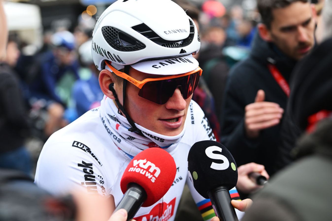 A wrapped up Van der Poel speaks to the media at the start