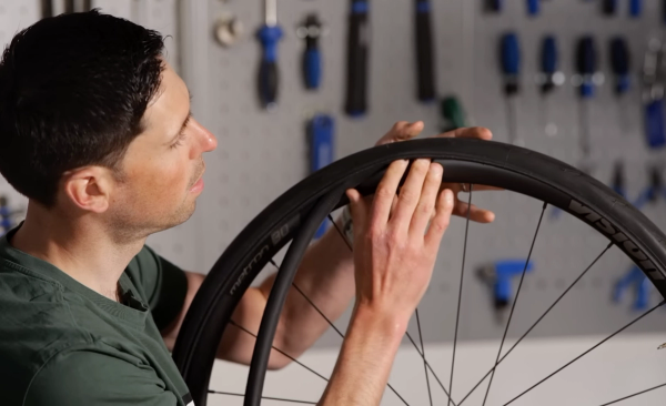 Push the tube into the tyre and rim