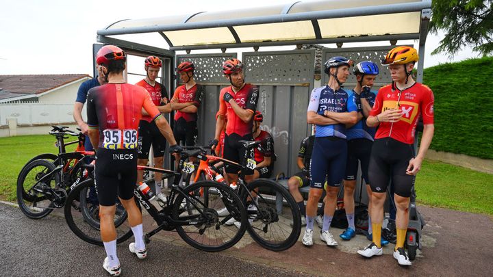 Riders shelter from the rain amid the neutralisation