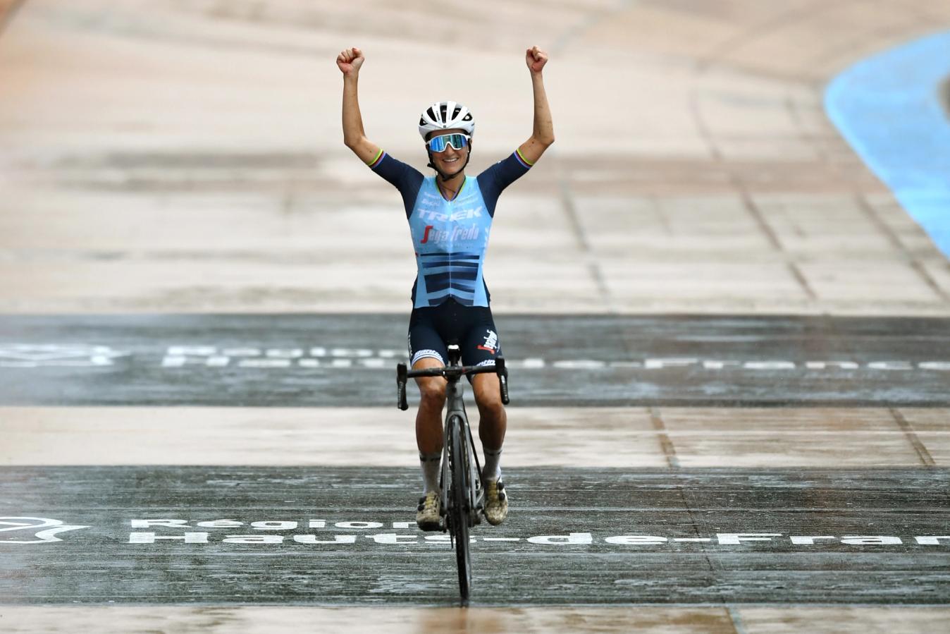 Lizzie Deignan crosses the line arms aloft to win the inaugural Paris-Roubaix Femmes in 2021