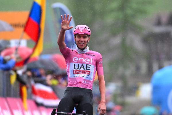 Tadej Pogačar holds up five digits - one for every stage win at this Giro d'Italia