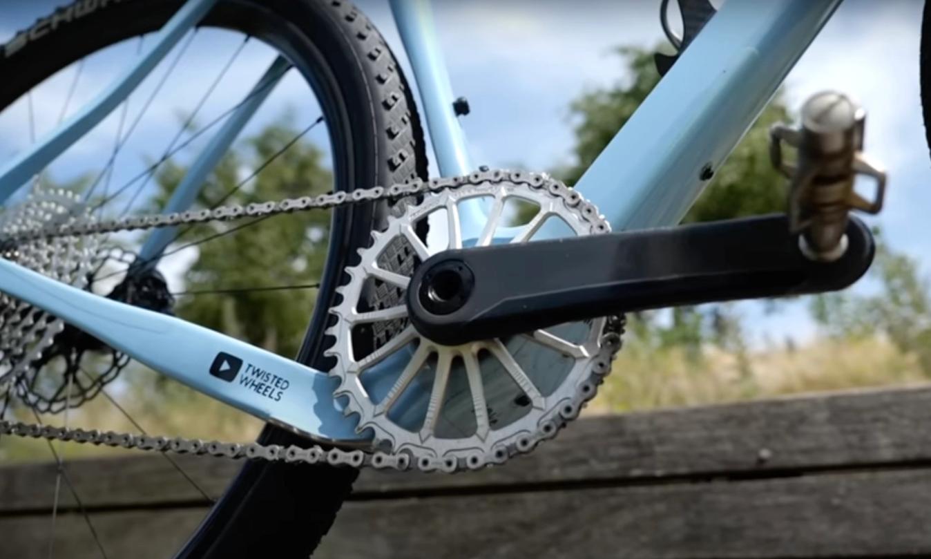 A Garbaruk lightweight chainring paired to some stealth SRAM Red cranks