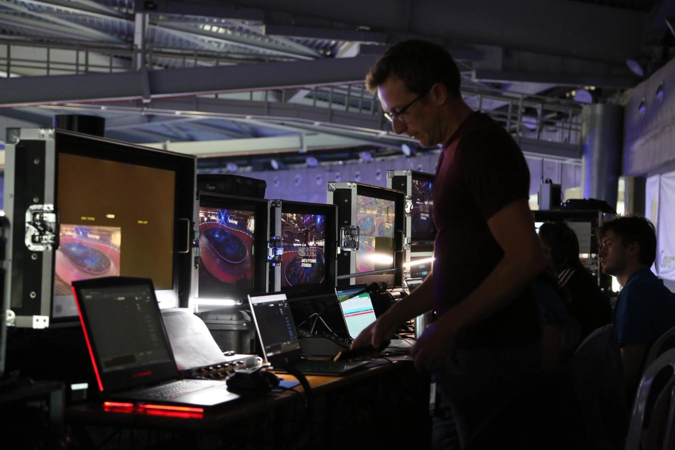 Backstage, banks of screens monitor everything meticulously