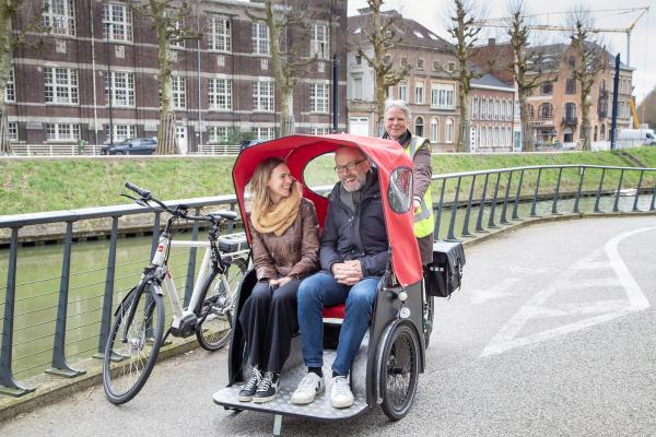 Deputy Mayor for Mobility Filip Watteeuw and Sofie Aelterman ride in a bike taxi