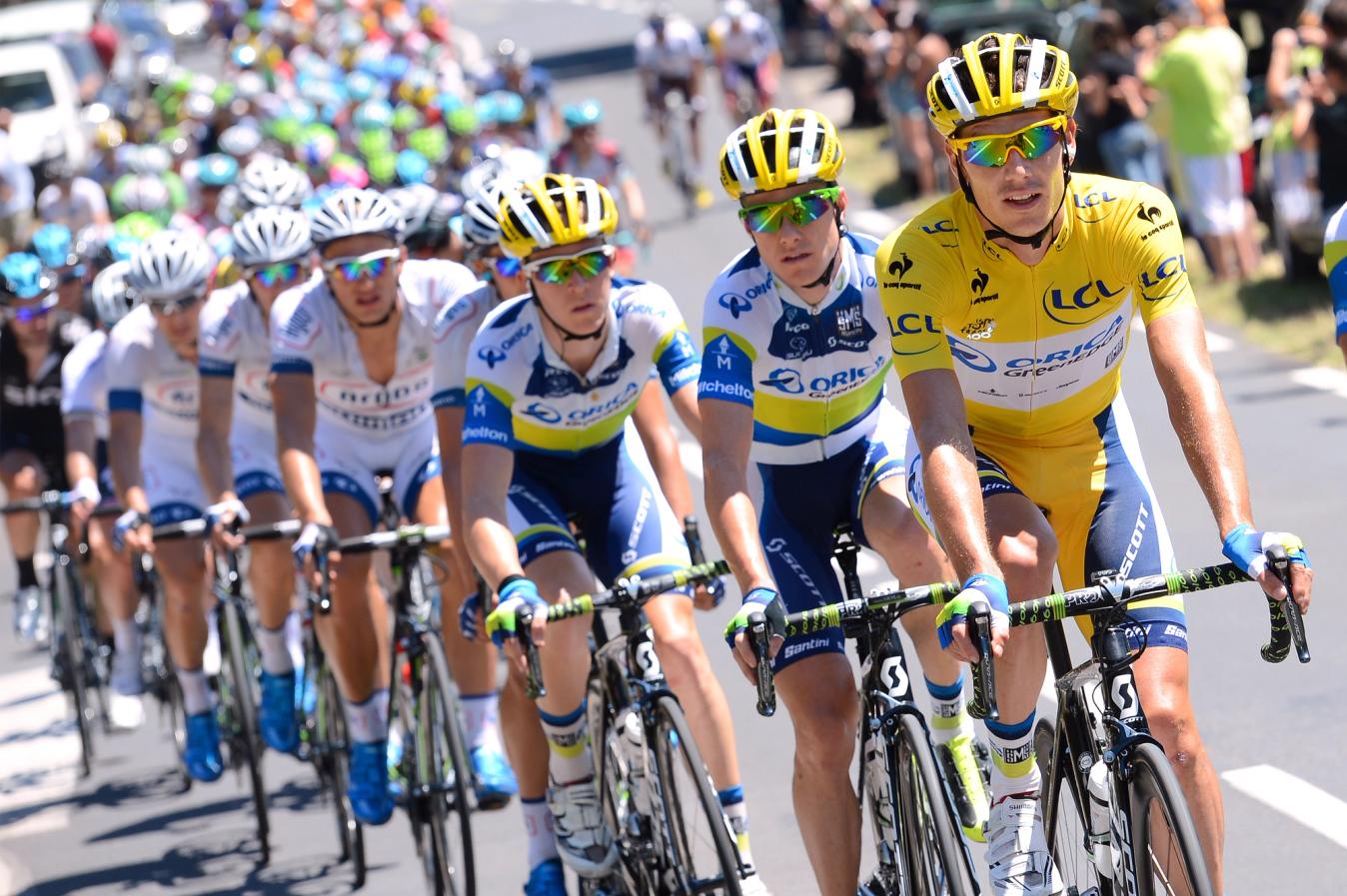 Impey wearing the yellow jersey in the 2013 Tour de France for Orica GreenEdge