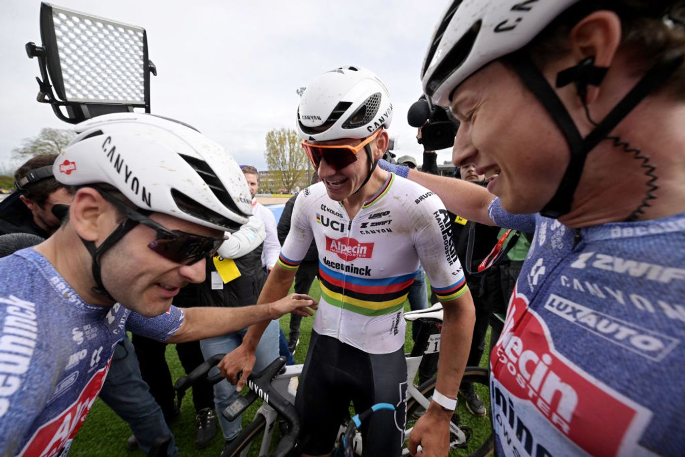 Vermeersch, Van der Poel and Philipsen (L-R) celebrate in the Roubaix velodrome