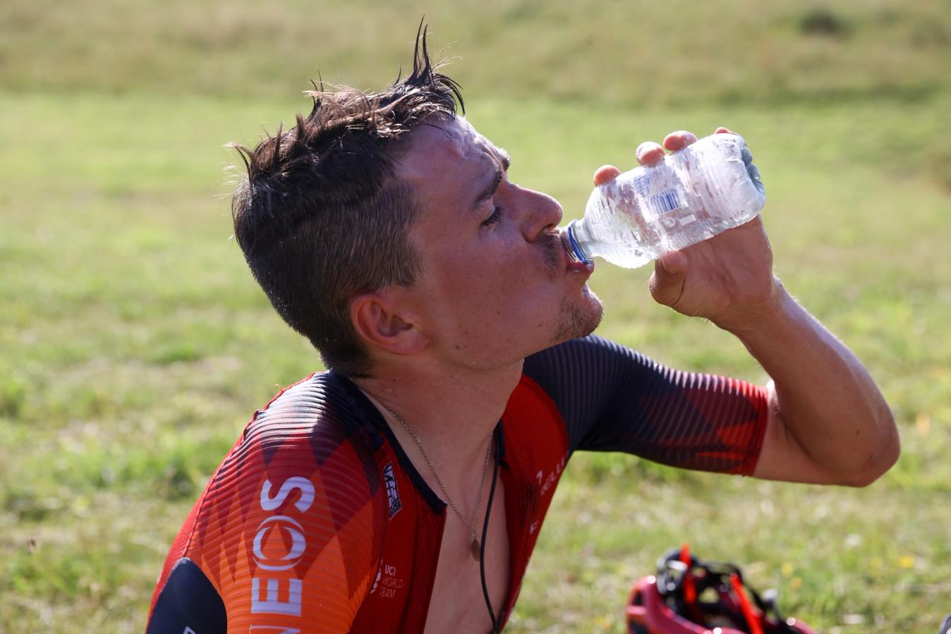 Recovering after a hot day on the Puy de Dôme, Tom Pidcock was grateful to have water immediately on hand