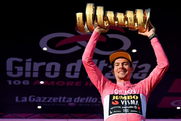 Primož Roglič wears the pink jersey and lifts the Giro d'Italia trophy in 2023