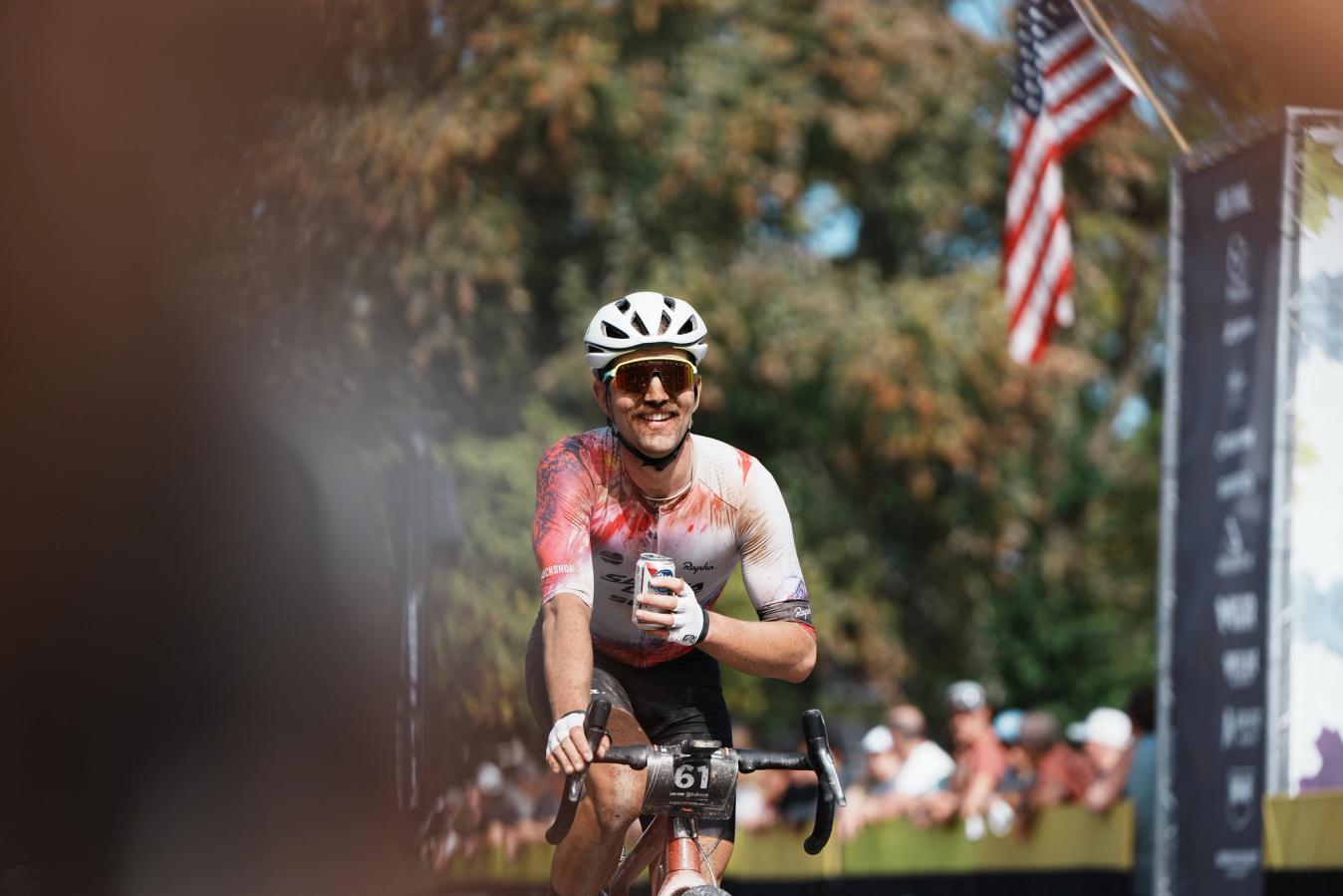 Tobin Ortenblad celebrating the end of the long Life Time Grand Prix season with a brew across the finish line of the Big Sugar Classic
