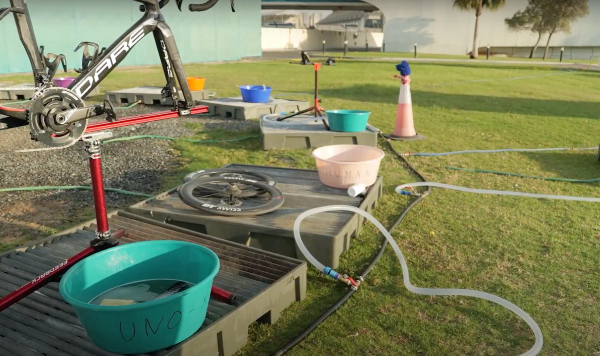 A pro bike wash set up station with minimal tools at the Women's UAE Tour